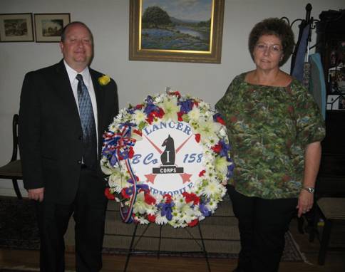 Linda and Martin Mussey with wreath1.jpg