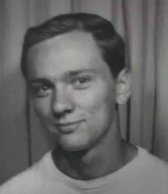 A person in a white shirt
Description automatically generated