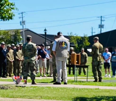 A group of people standing outside

Description automatically generated with low confidence