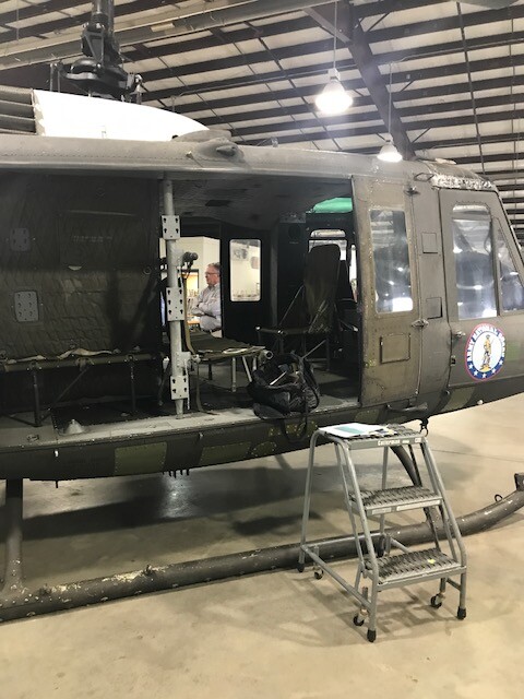 A helicopter in a hangar
Description automatically generated